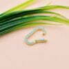 Double the Dazzle: Two-Sided Gemstone Charms Lock in Luxury