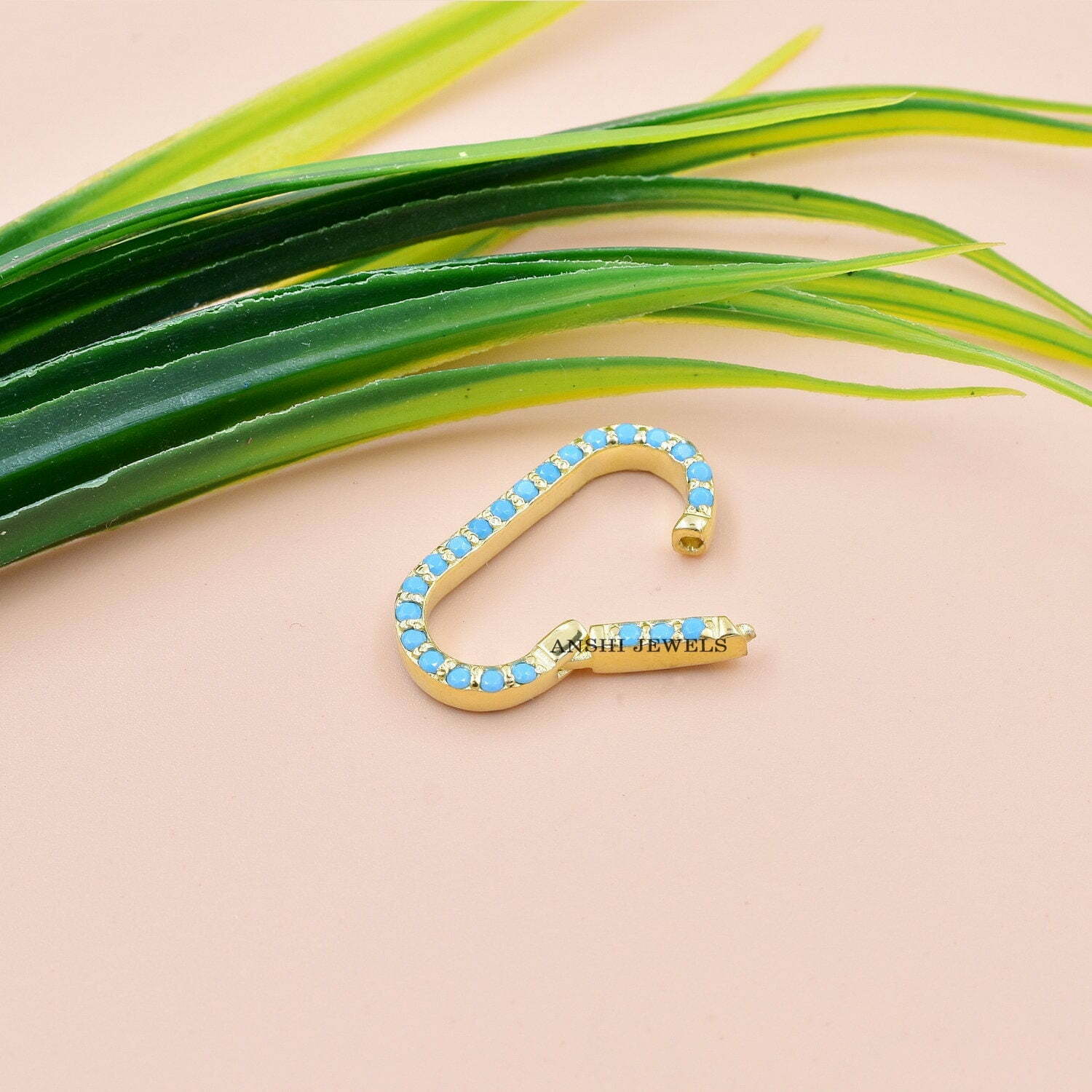 Double the Dazzle: Two-Sided Gemstone Charms Lock in Luxury